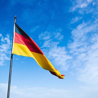 German flag against a blue sky