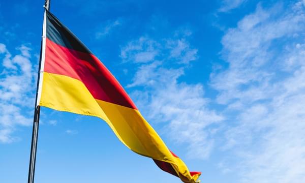 German flag against a blue sky